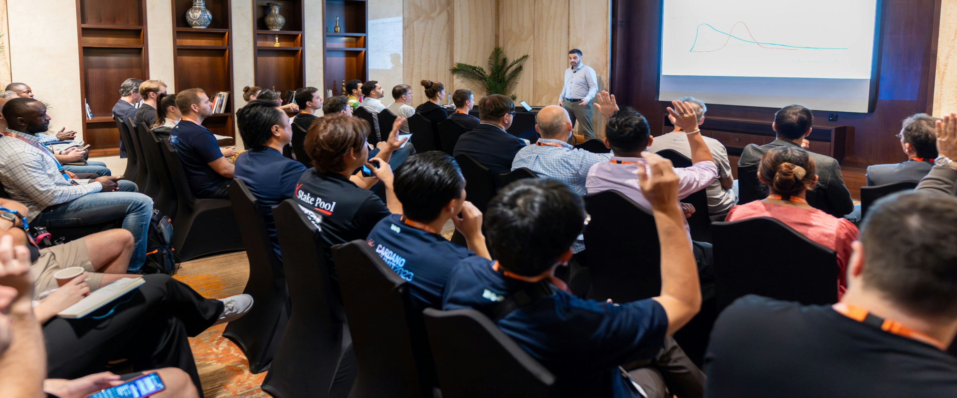 An image of a crowd of people listening to a keynote speech.