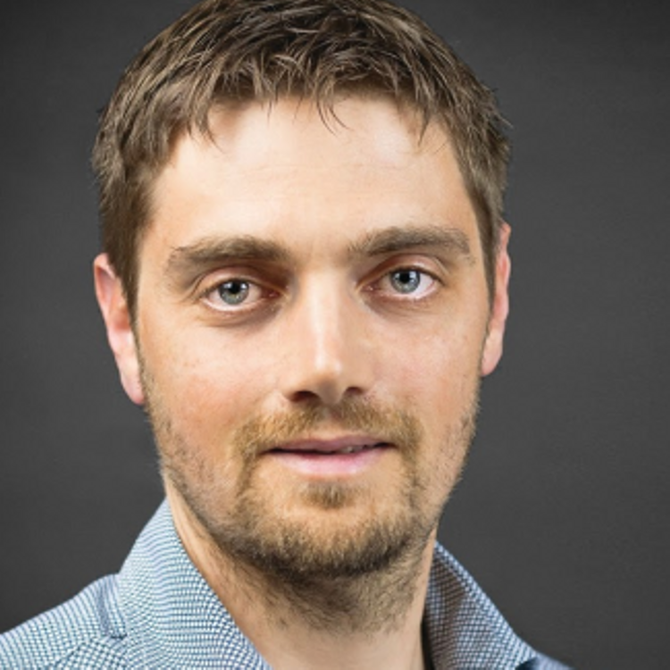 A professional headshot of Markus Gufler.