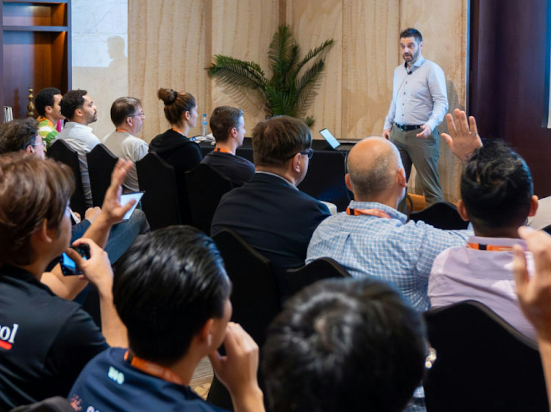 An image of a crowd of people listening to a keynote speech.