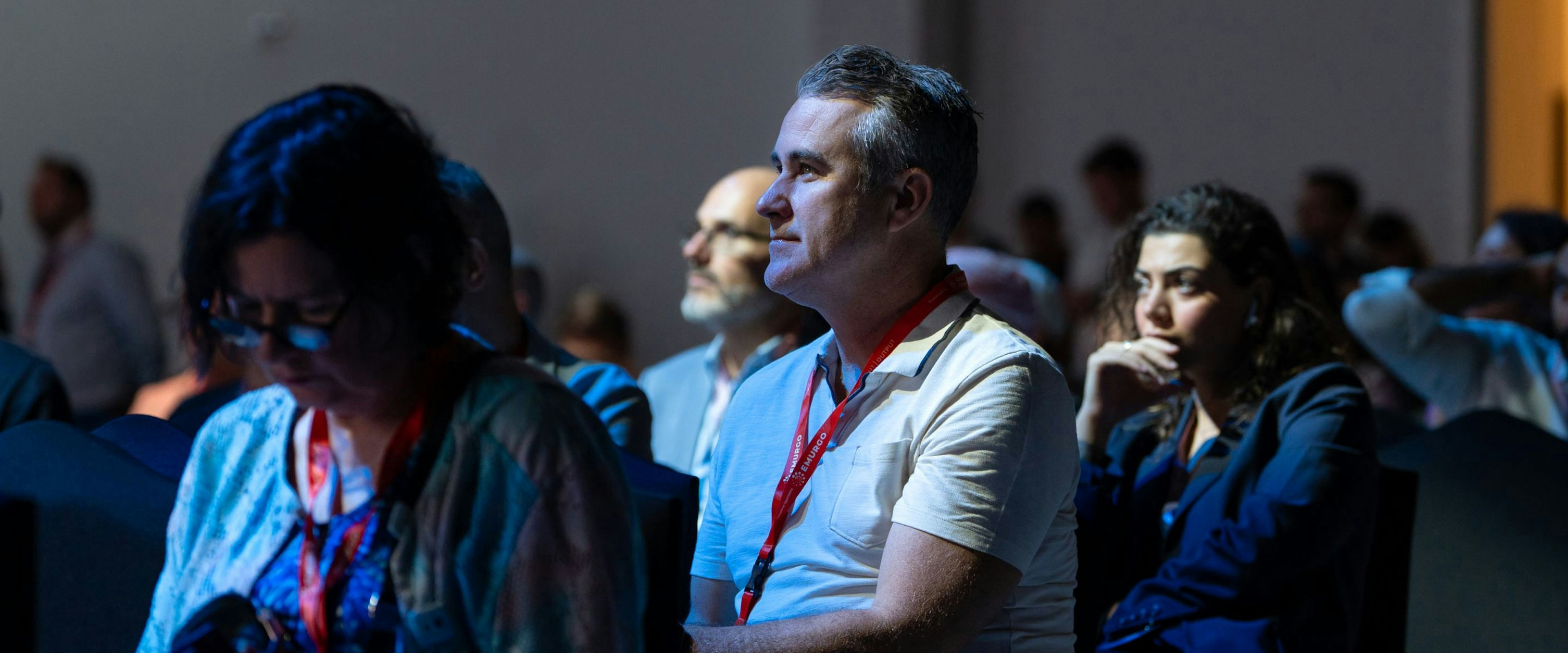 An image of a crowd of people listening to a keynote speech.