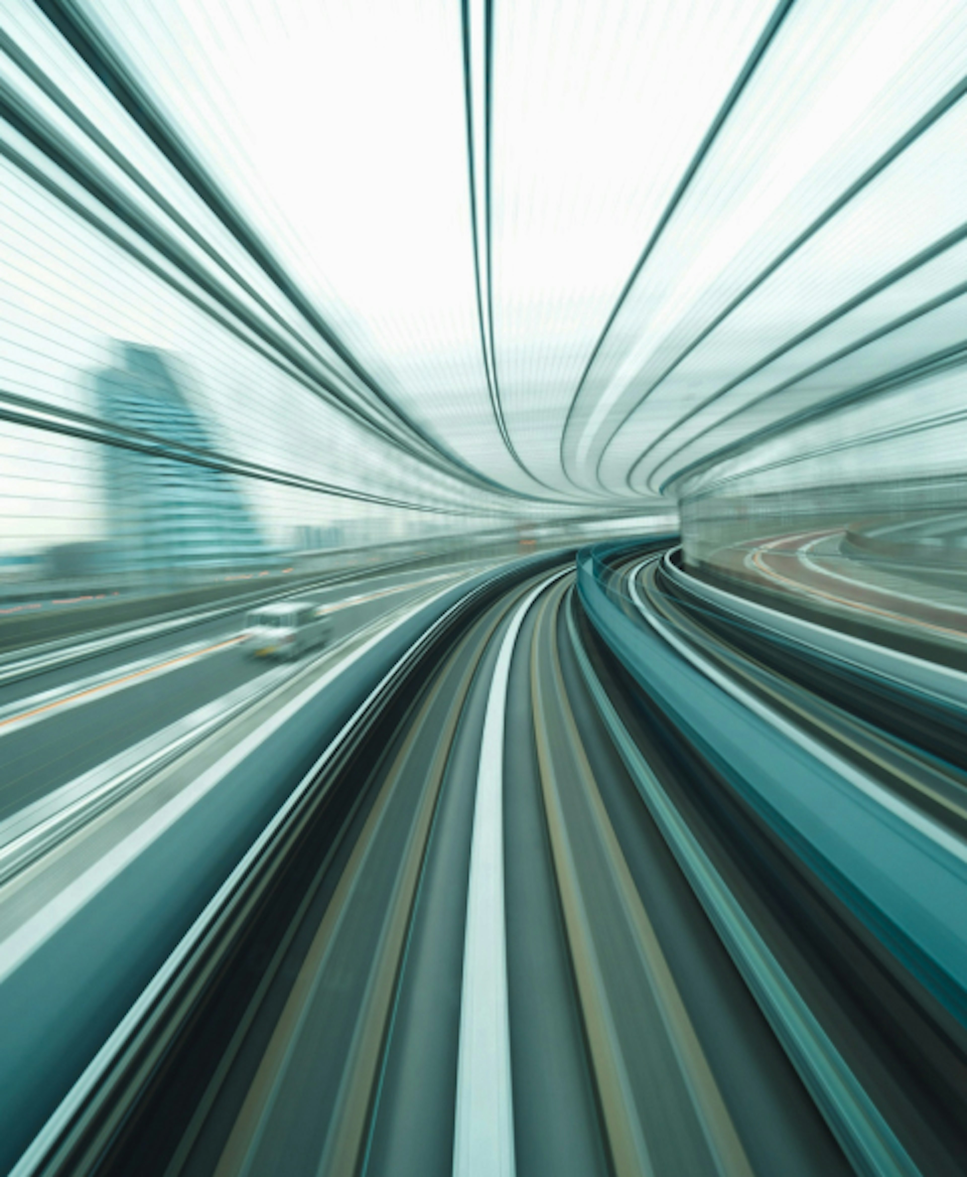 An image as seen from the front of a moving train with motion blur.