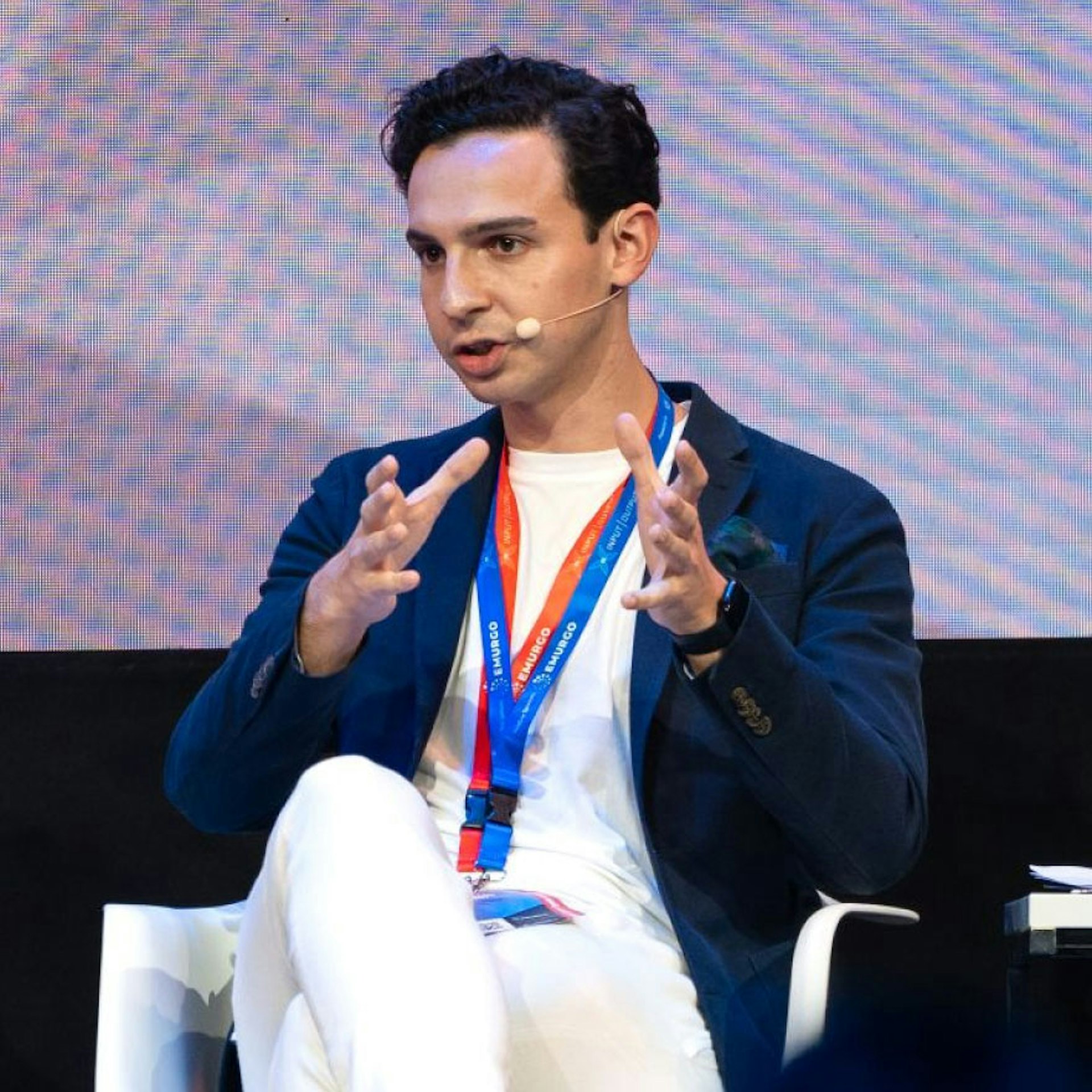 An image of Alexandre Maaza speaking in a panel.