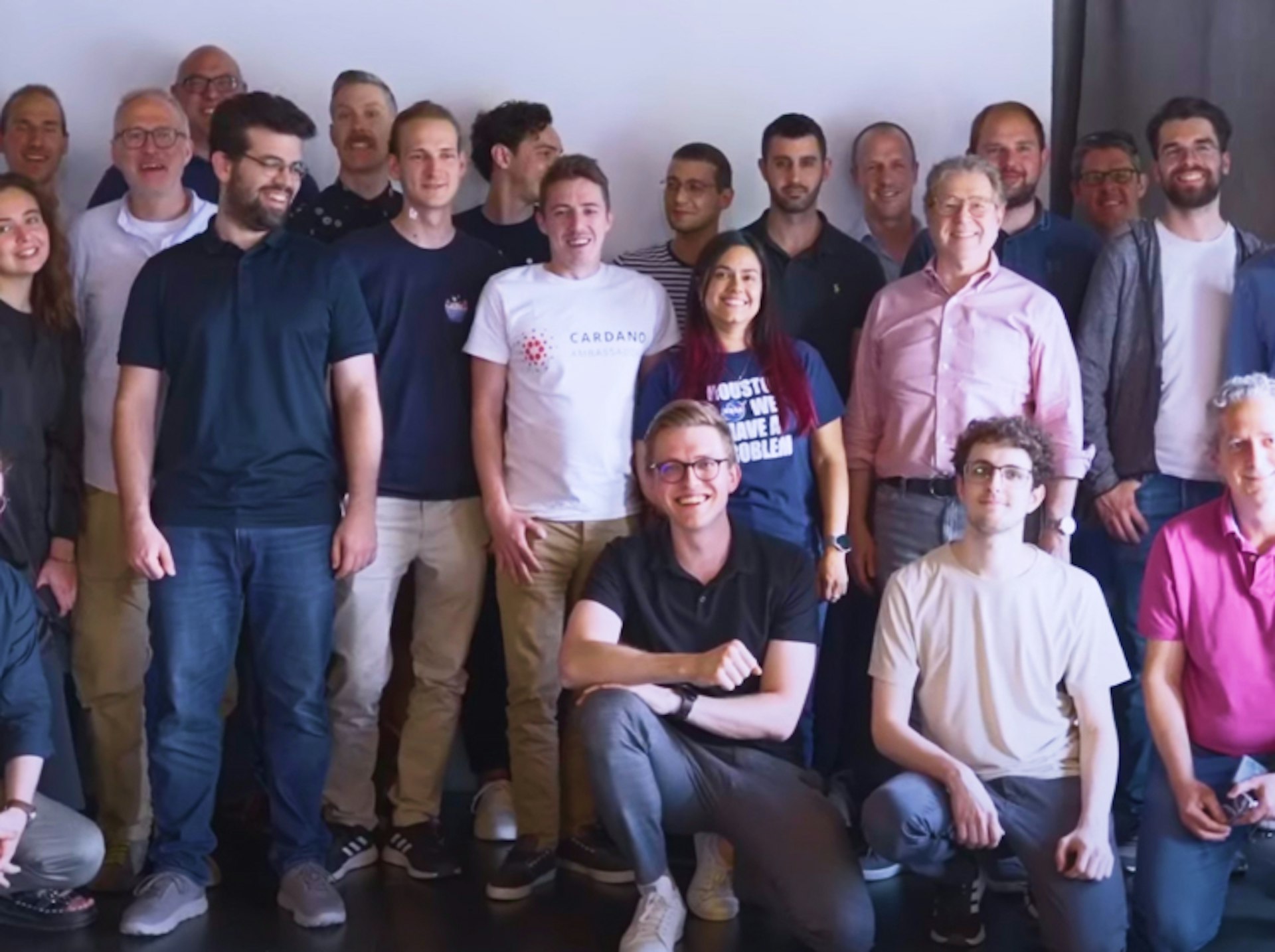 A photograph of Cardano community members all together.